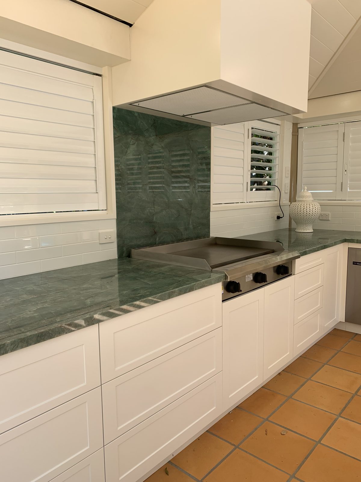 Outdoor kitchen with white shaker doors