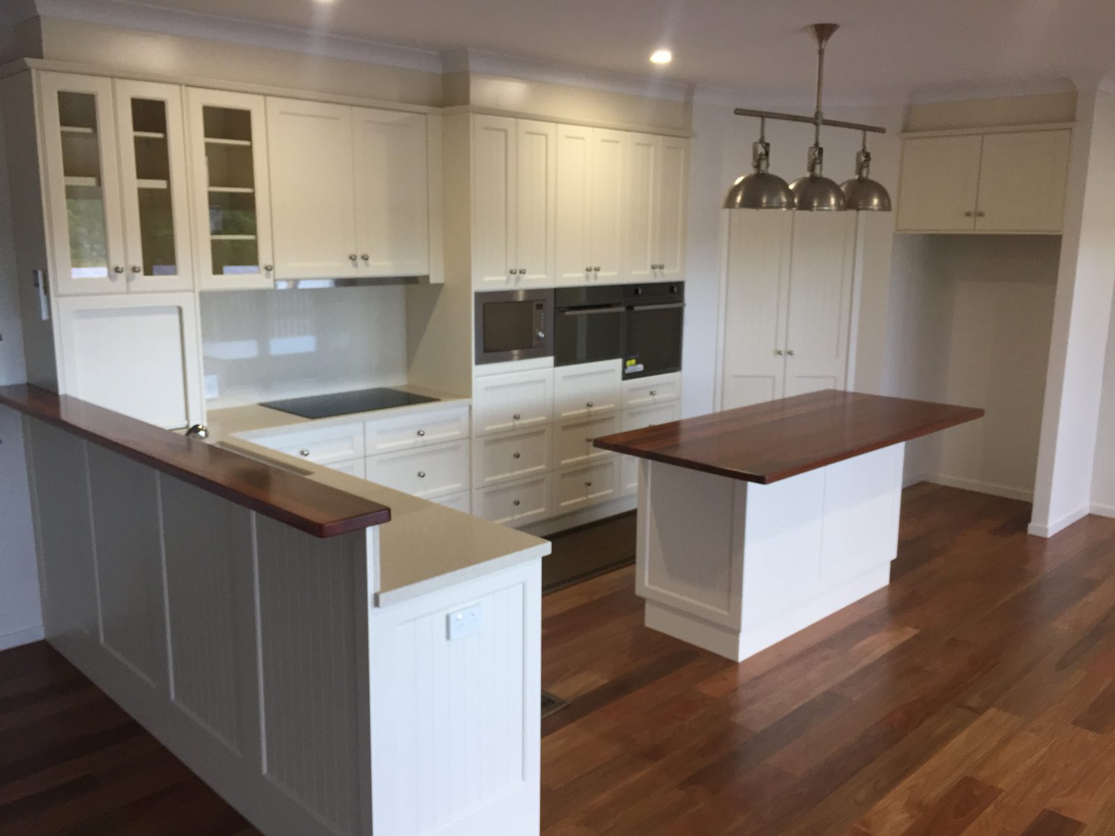 Cream shaker kitchen with timber island